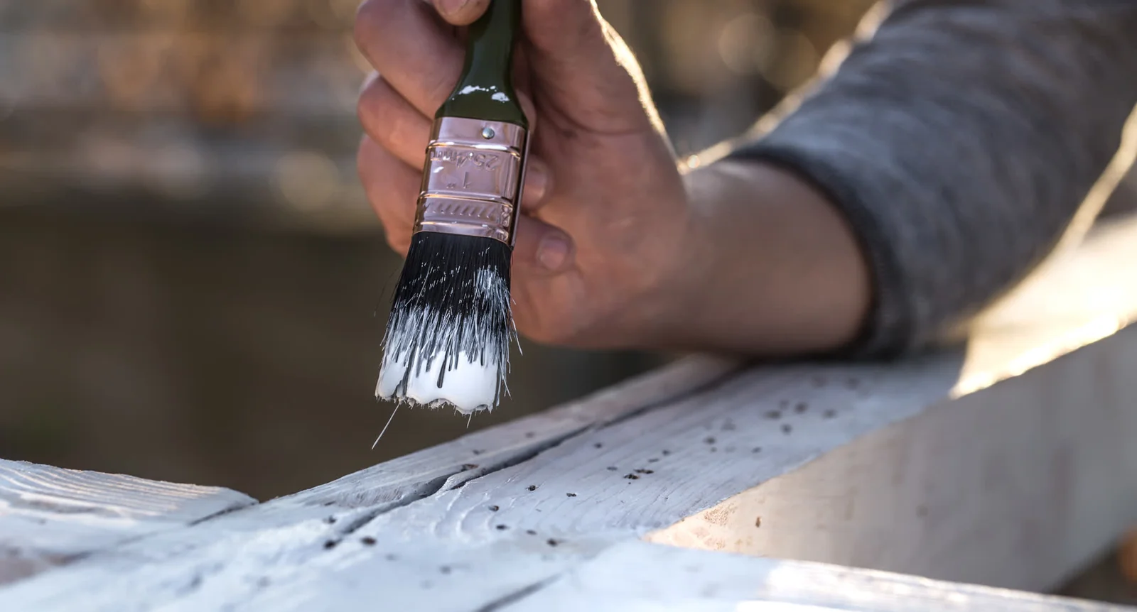 Water-based finish being applied to a timber surface